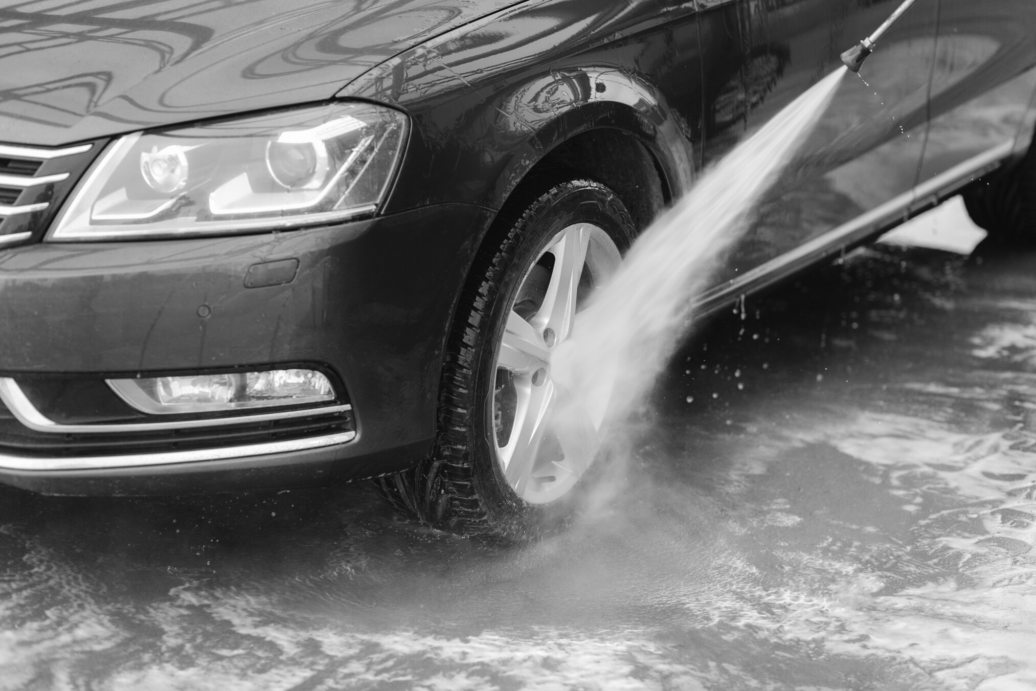PersonPressure Washing His Car Tires 